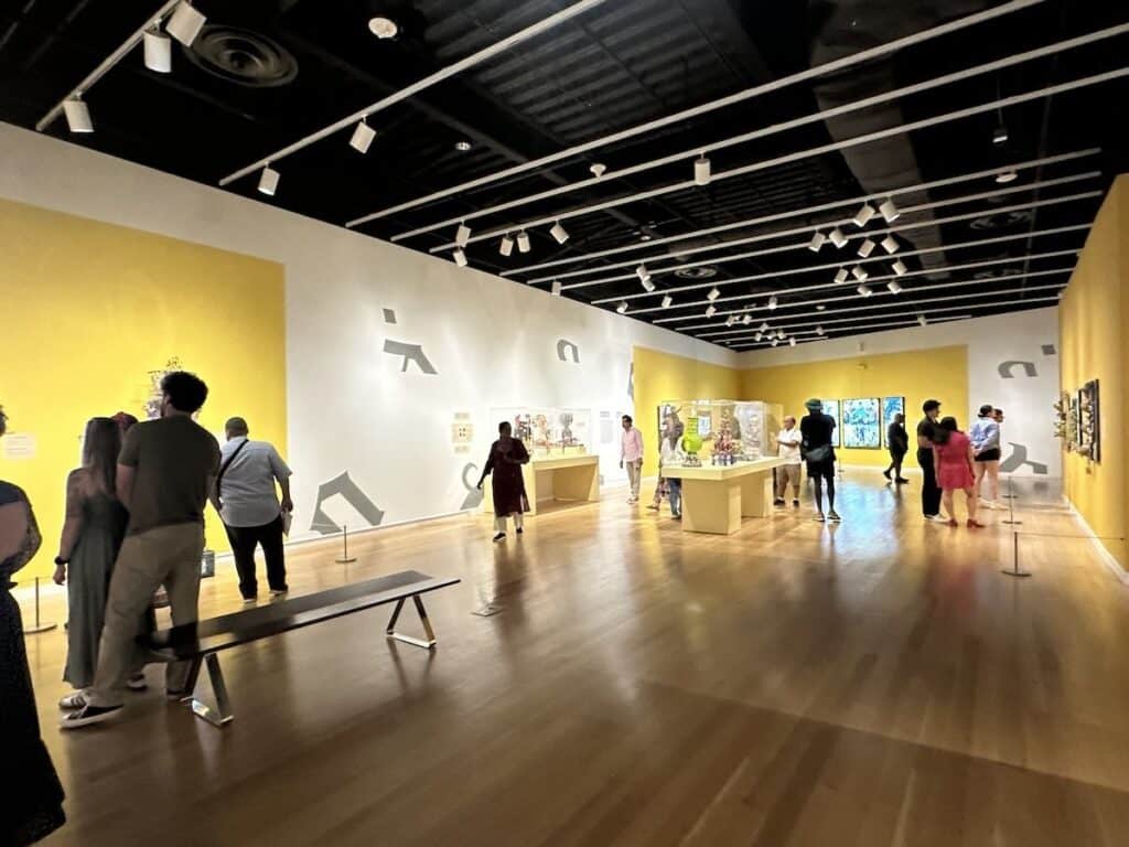 People looking at art in a gallery at Mint Museum in Charlotte, NC