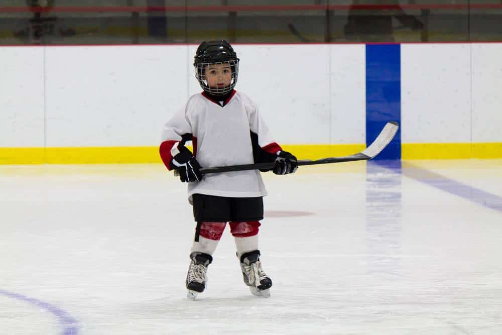 Little boy playing ice hockey Charlotte On The Cheap
