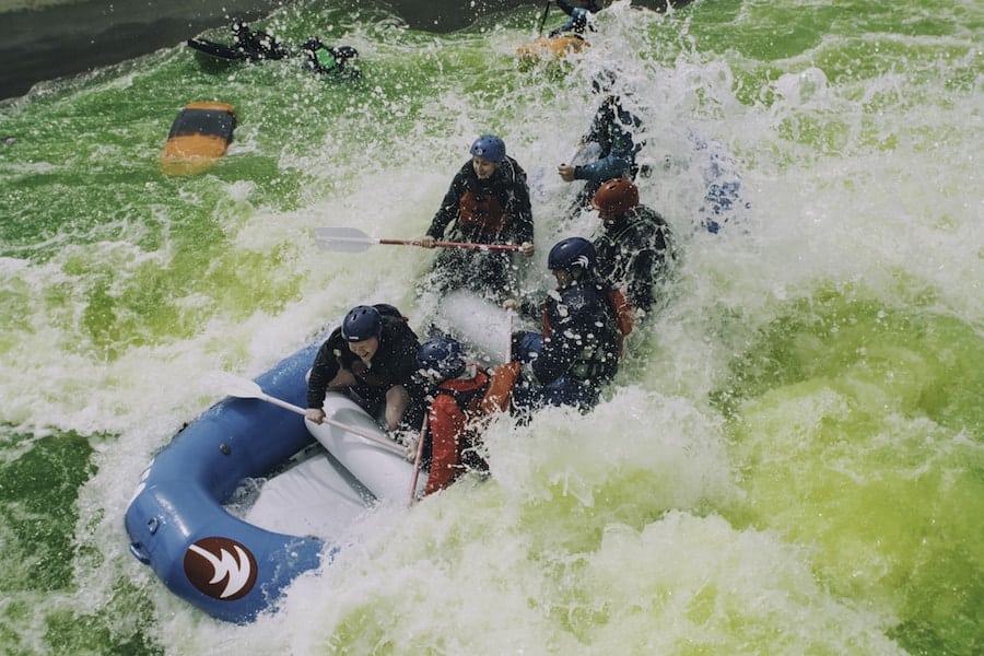 rafters in a green river