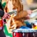 closeup of guitarist and drummer at outdoor concert