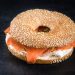sesame seed bagel with cream cheese and smoked salmon / lox