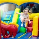 child jumping on inflatable play area