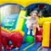 child jumping on inflatable play area