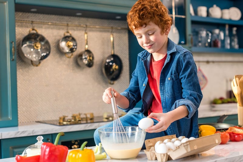 redhead boy cooking