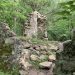ruins of a stone house in the woods