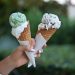 hand holding two ice cream cones