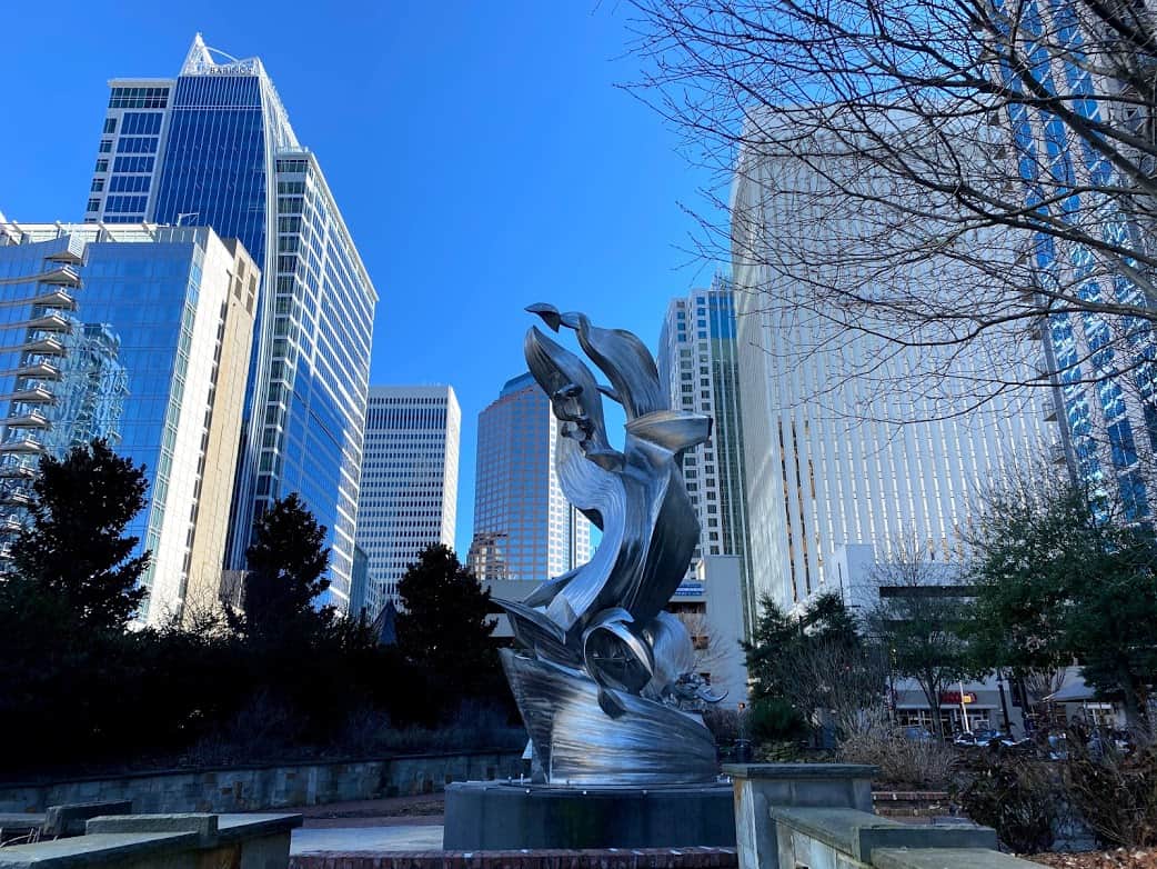 Spiral Odyssey sculpture and Charlotte skyline from Romare Bearden Park