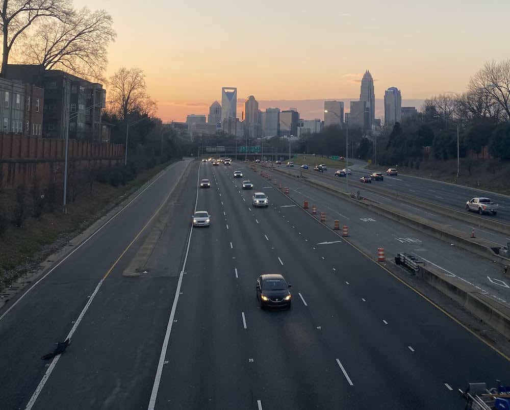 view of Charlotte skyline from Hawthorne Lane Bridge at sunset