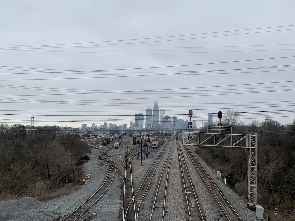 View of Charlotte skyline and train tracks from Matheson Bridge