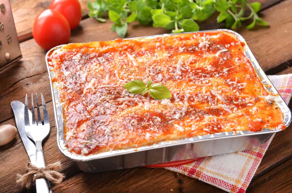 homemade lasagna in a foil pan