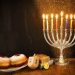 Menorah, donuts and dreidels for Hanukkah