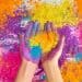 Hands holding colored powder for Holi celebration