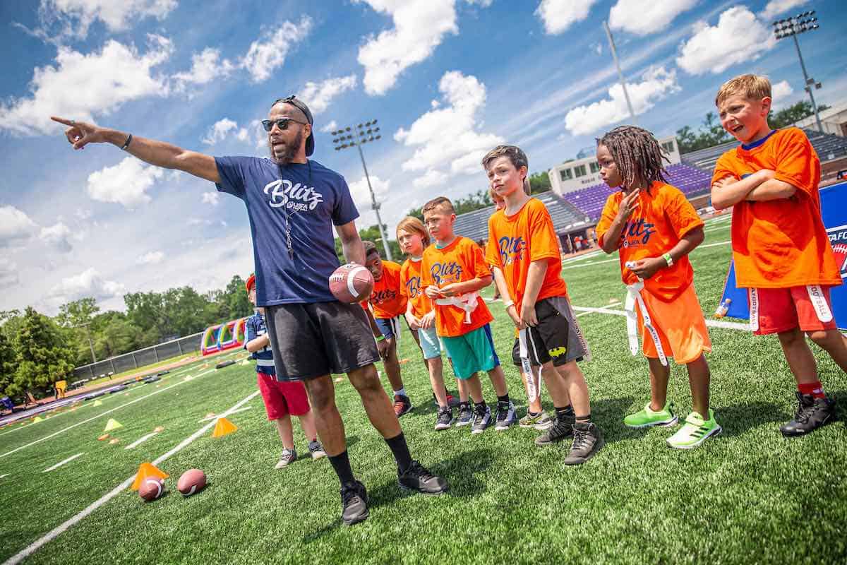 football coach instructing children