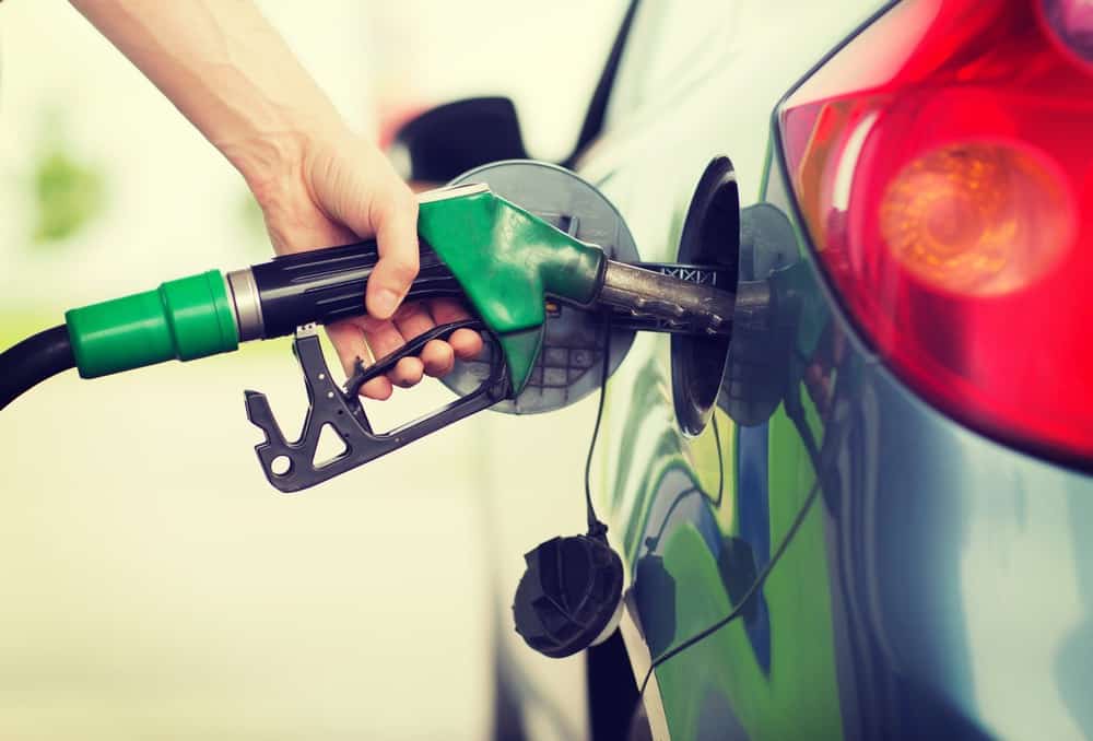 person pumping gas