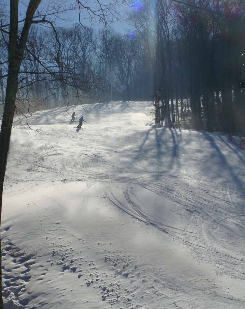 Two people skiing