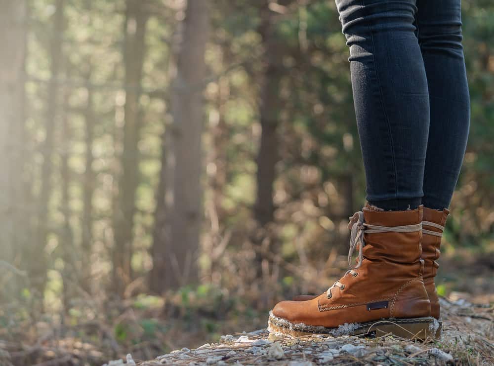 Close-up of hiking boots in a forest