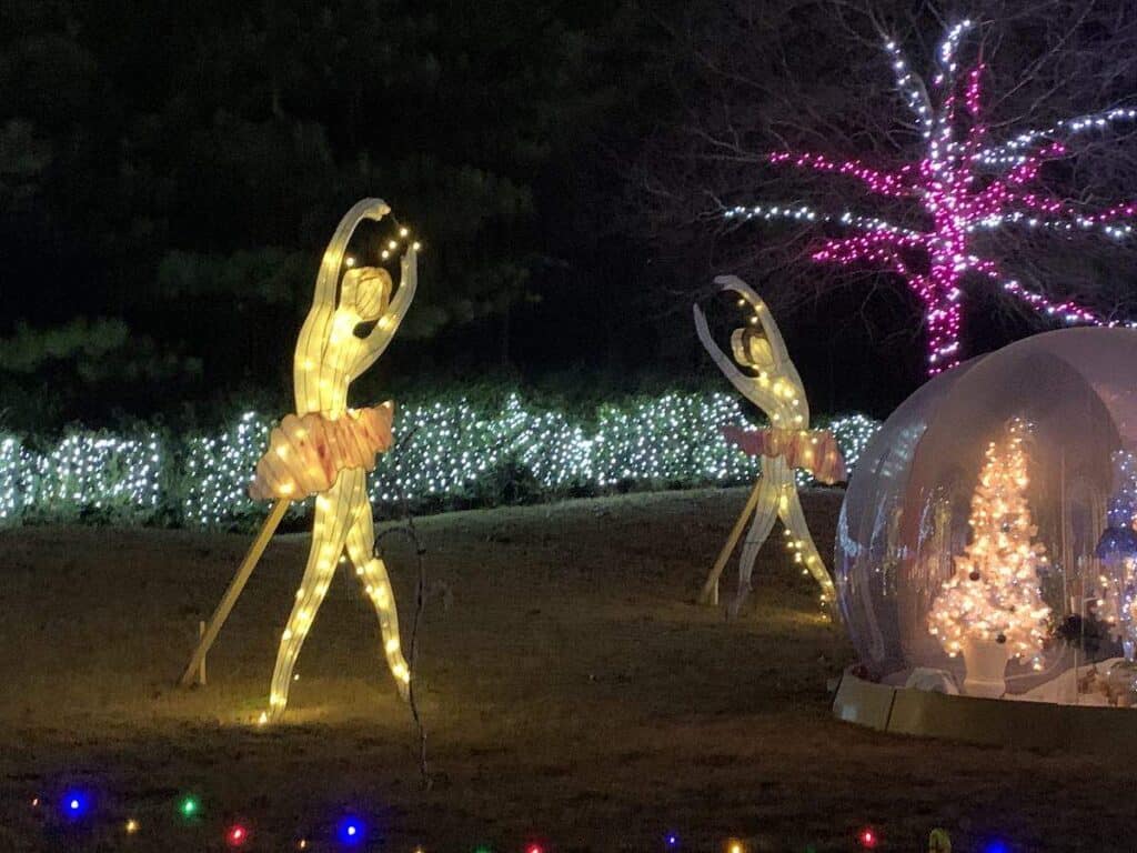 Light sculptures of ballerina in Christmas display