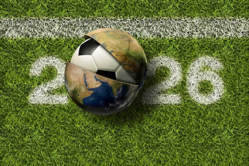 soccer ball emerging from globe