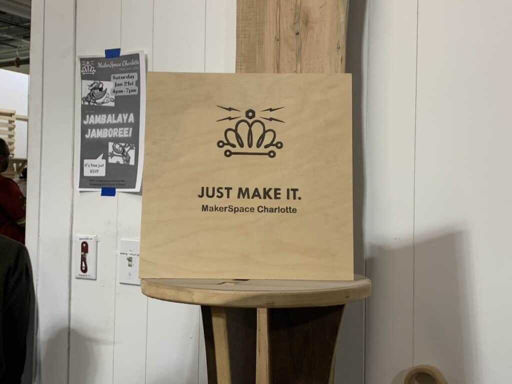 sign saying "just make it. makerspace charlotte."