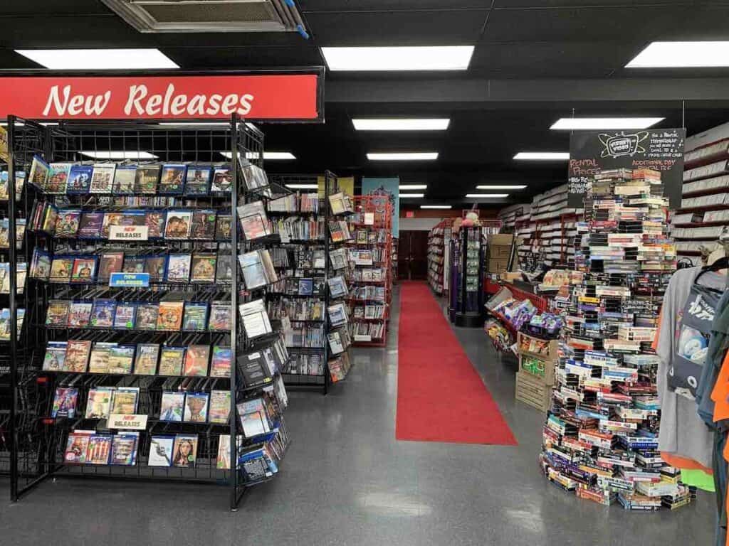 Interior of VisArt Video in Charlotte, North Carolina. Movie rentals on shelves.