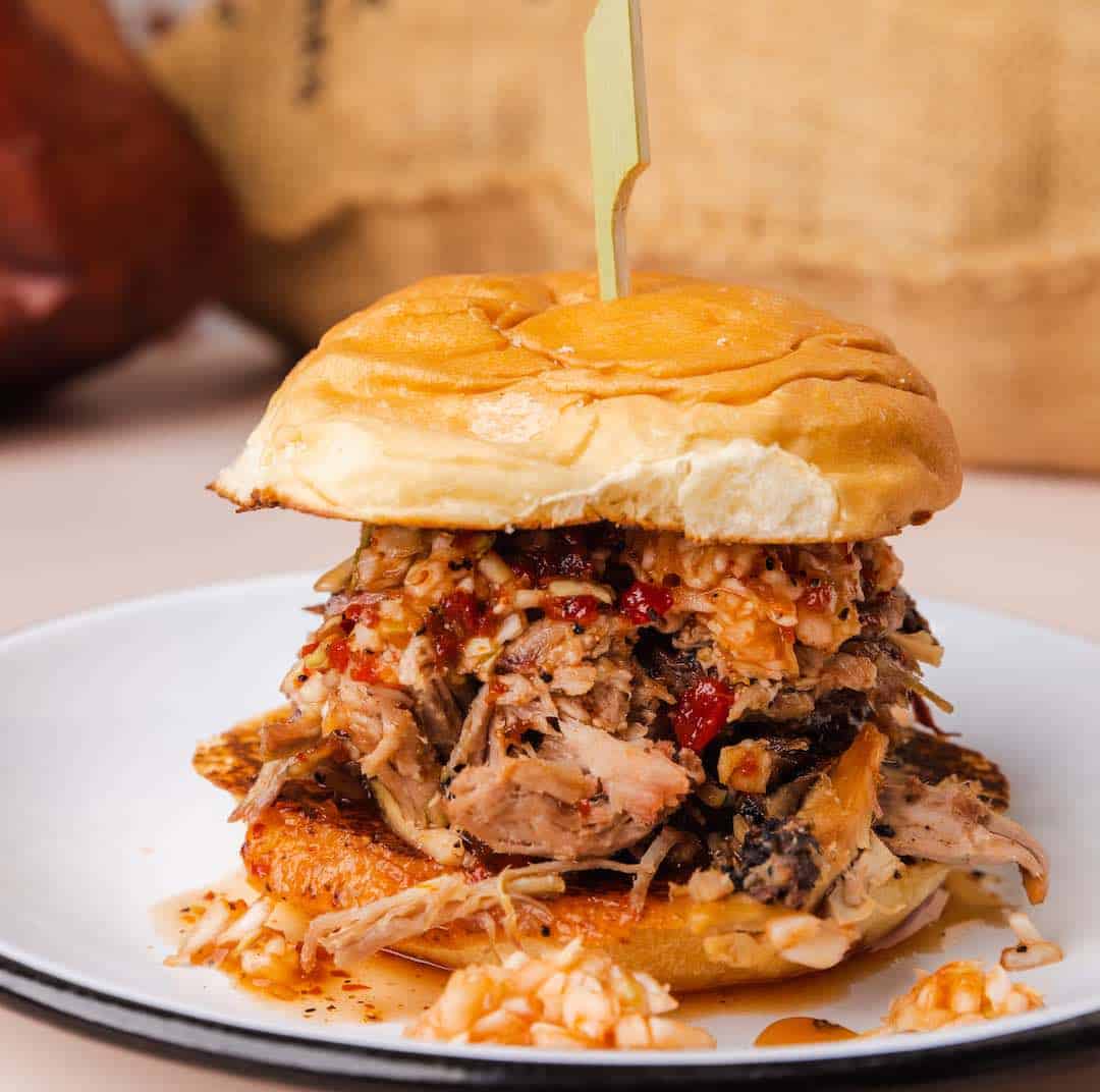 Noble Smoke at Optimist Hall Buy one pork sandwich get one free March