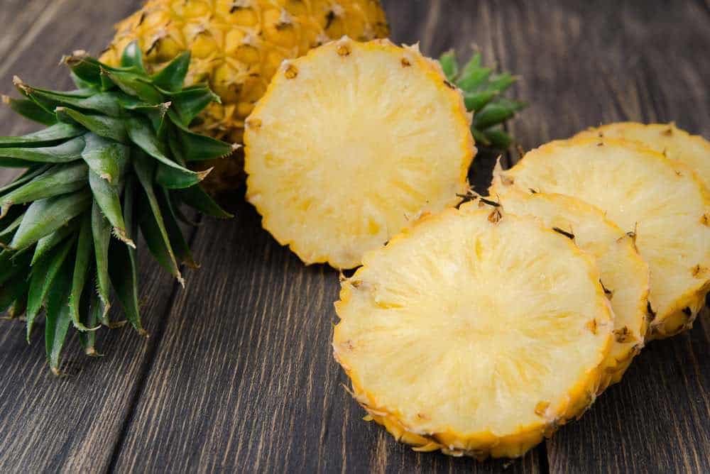 sliced pineapple on a table