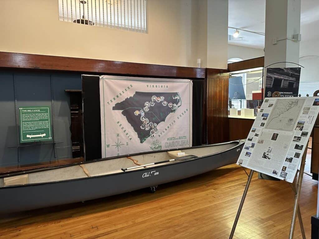 "A Delicious Country" exhibit at Kings Mountain Historical Museum, including a canoe