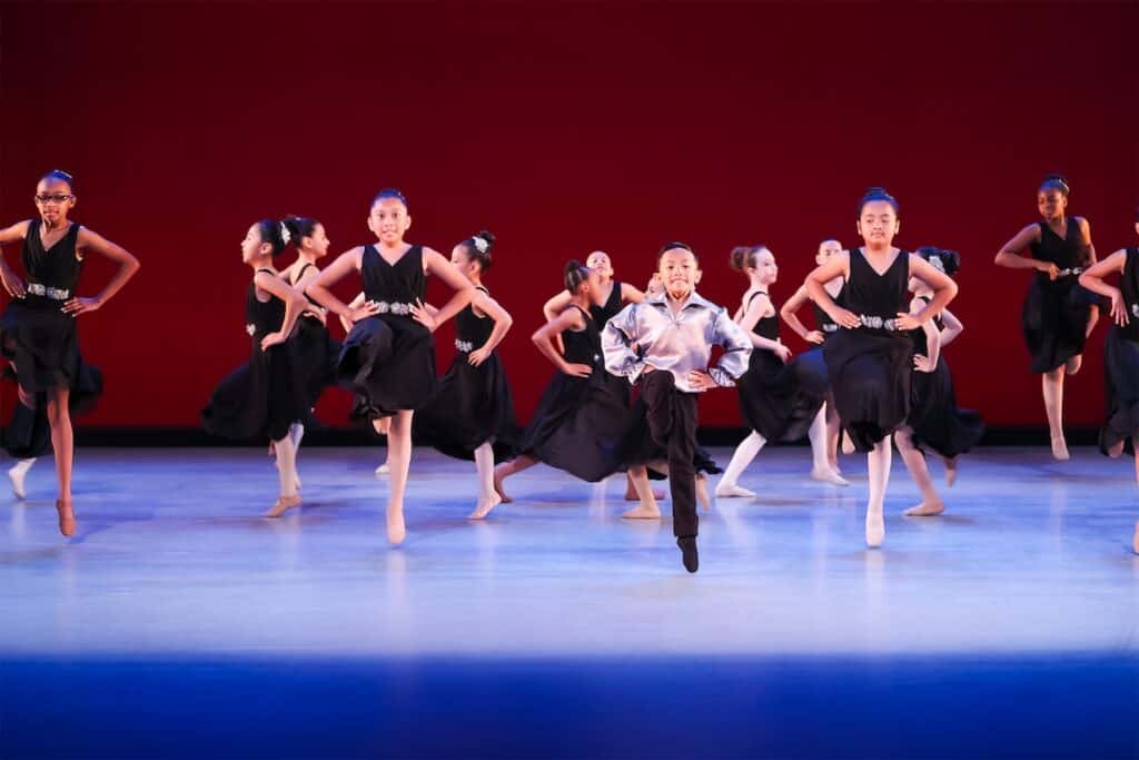 Children dancing on a stage