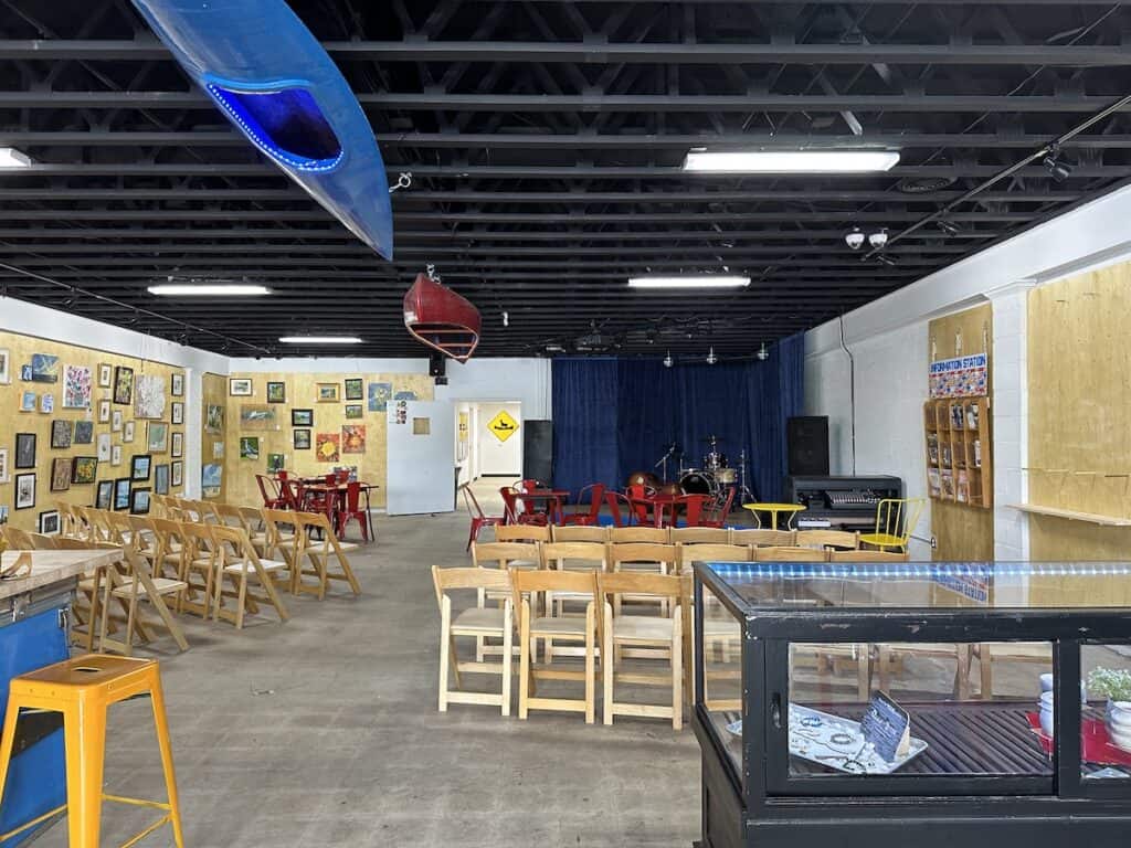 Interior of Confluence. Stage with a drum set, chairs