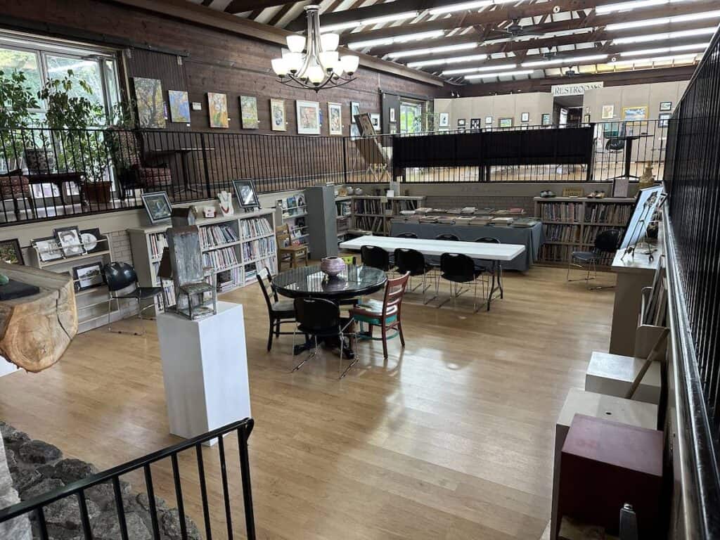 interior of Southern Arts Society. Tables and chairs and books and art