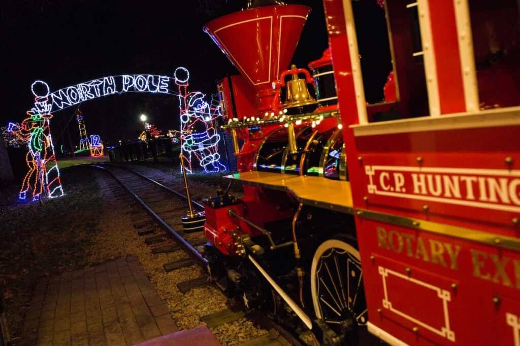 Red Train approaching North Pole sign