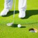Putting Golf Ball into the Hole, Close up detail Shot