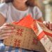 child opening a present
