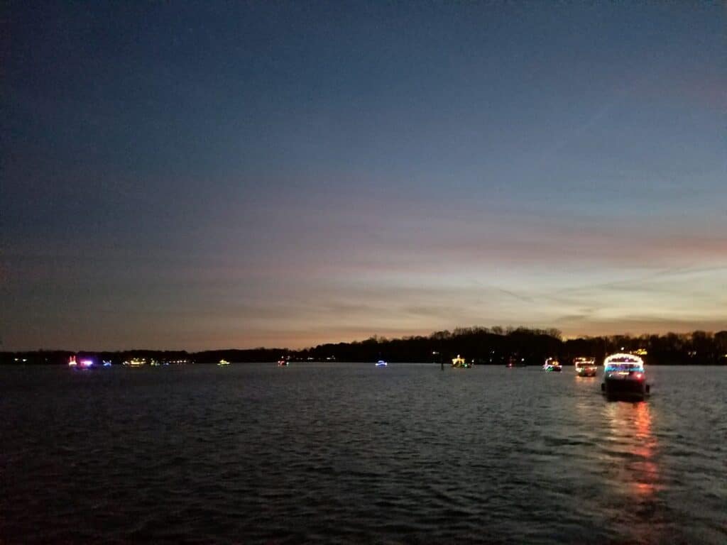 lighted boats on lake