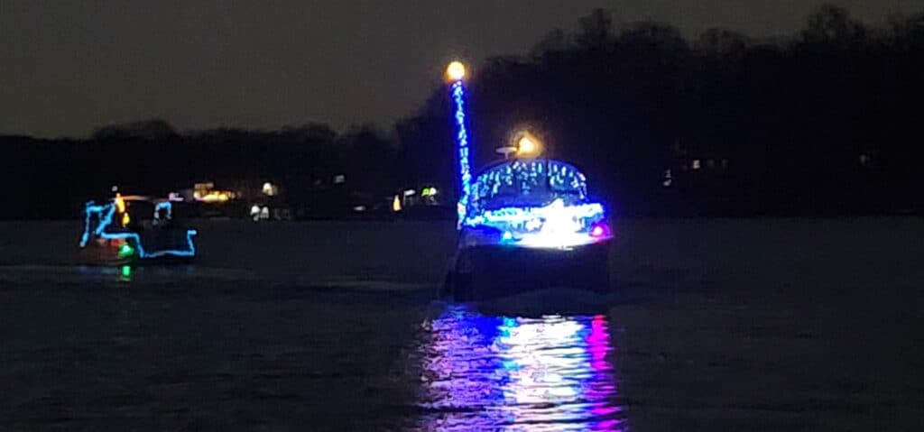 lighted boat on lake