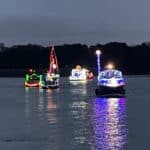 lighted boats on lake
