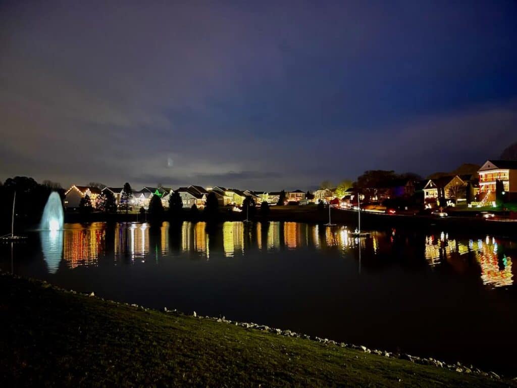 Reflection of decorated houses on lake at McAdenville, NC
