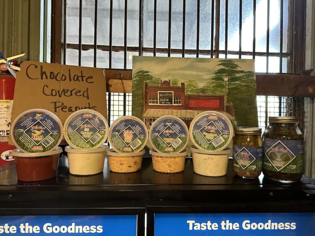 containers of pimento cheese, salsa, collards, pickles
