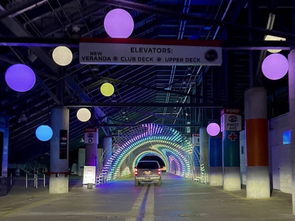car going through lighted tunnel at Speedwa Christmas