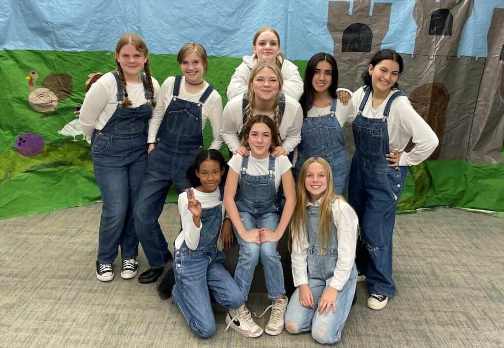 group picture of girls in overalls