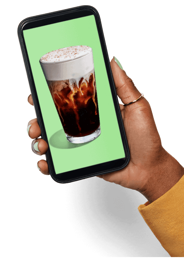 hand holding phone with picture of beverage on it