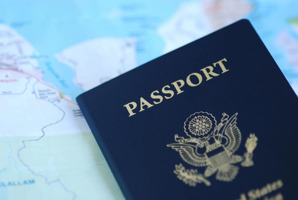 United States passport lying on a map