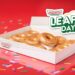 dozen Krispy Kreme doughnuts in a box with words Leap Day