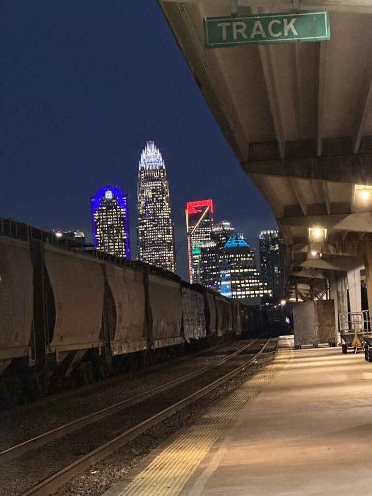 view of Charlotte, NC skyline from the train station at night