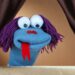 blue puppet on brown background