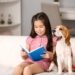 girl reading to dog