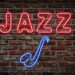 Glowing neon jazz sing on a brick wall.