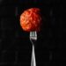 Meatball on a fork for national meatball day at piada