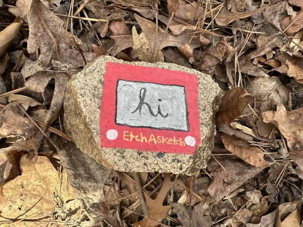 Rock painted with picture of etch a sketch