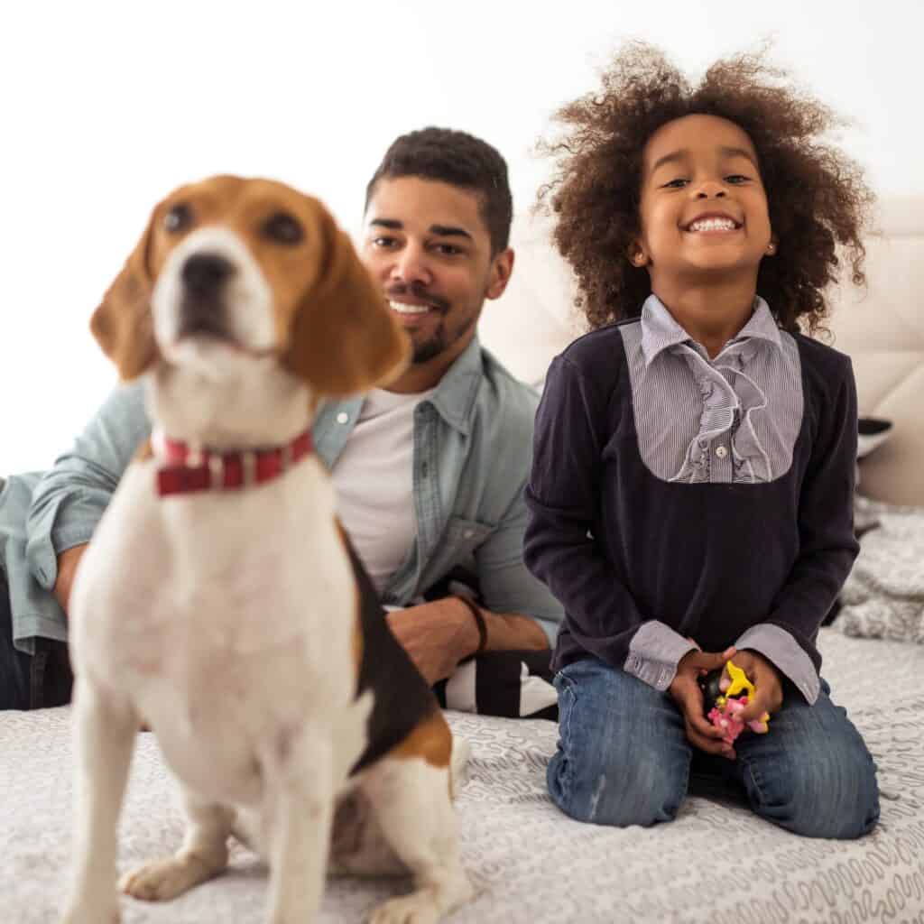 Girl and father with dog
